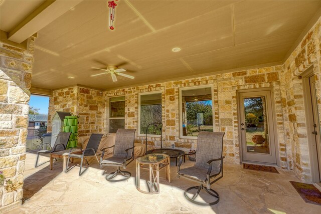 view of patio featuring ceiling fan