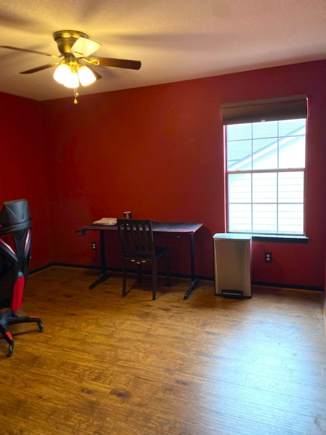 office space with wood finished floors and a ceiling fan