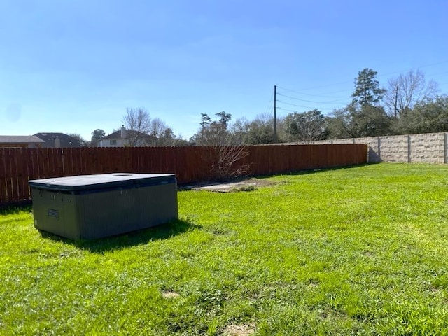 view of yard with a fenced backyard