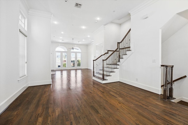 unfurnished living room featuring ceiling fan, dark hardwood / wood-style floors, and ornamental molding