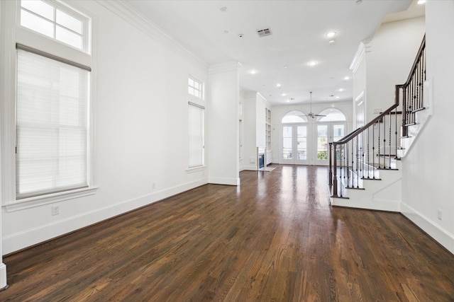 interior space featuring french doors, dark wood-type flooring, ceiling fan, and ornamental molding