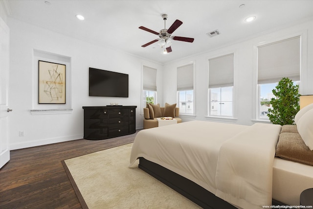 bedroom with multiple windows, ceiling fan, crown molding, and dark hardwood / wood-style floors