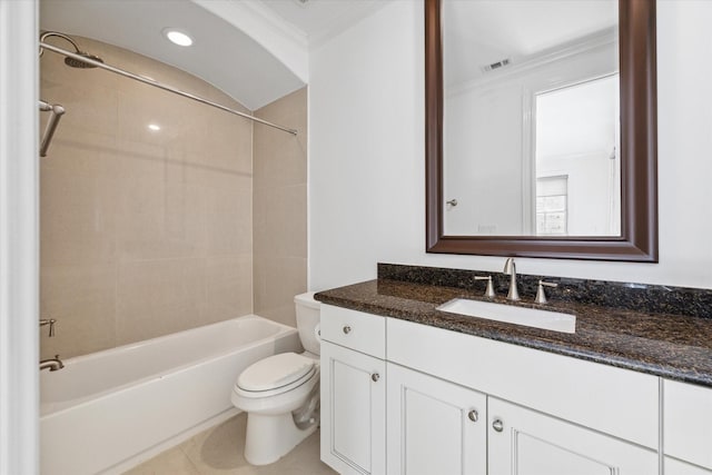 full bathroom with vanity, crown molding, tile patterned flooring, toilet, and tiled shower / bath