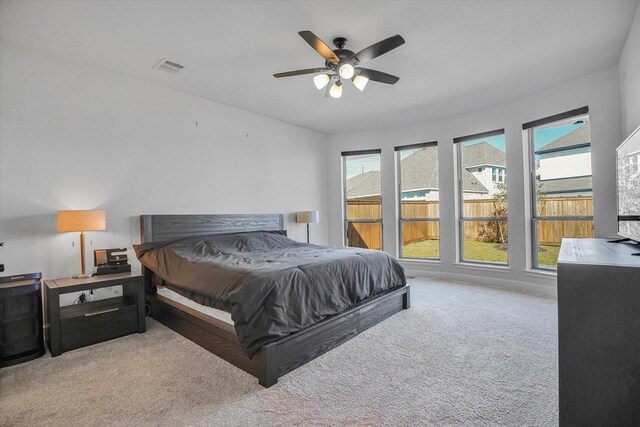 carpeted bedroom featuring ceiling fan