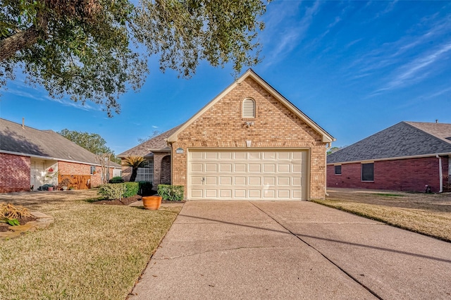 view of property featuring a garage and a front lawn