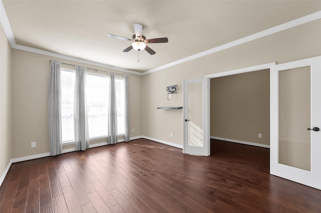 empty room with crown molding, ceiling fan, dark hardwood / wood-style flooring, and french doors