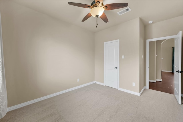 unfurnished bedroom featuring ceiling fan and carpet floors