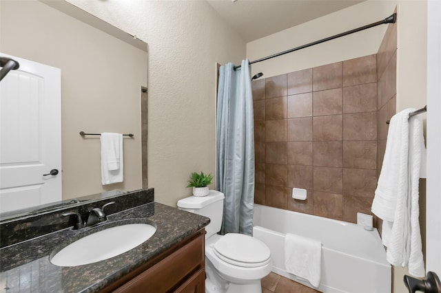 full bathroom featuring shower / tub combo with curtain, a textured wall, toilet, vanity, and tile patterned floors