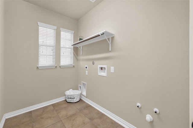 clothes washing area with laundry area, baseboards, hookup for a gas dryer, hookup for a washing machine, and electric dryer hookup