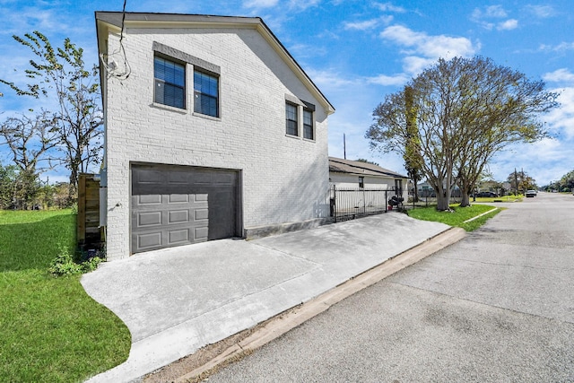 view of property exterior featuring a garage and a yard