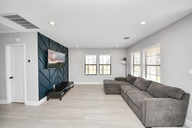 living room with light hardwood / wood-style floors