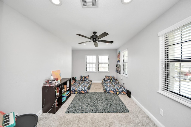 rec room featuring ceiling fan and carpet floors