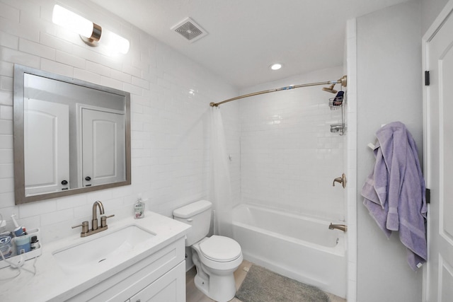 full bathroom with toilet, vanity, backsplash, tile walls, and shower / bathtub combination with curtain