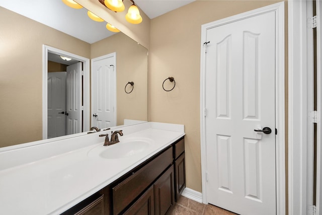 bathroom with tile patterned flooring and vanity