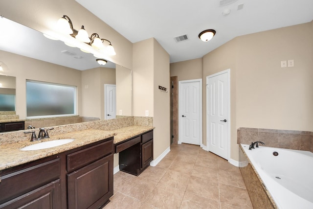 bathroom featuring tile patterned floors, vanity, and plus walk in shower