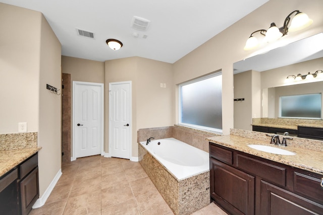 bathroom with tile patterned floors, separate shower and tub, and vanity