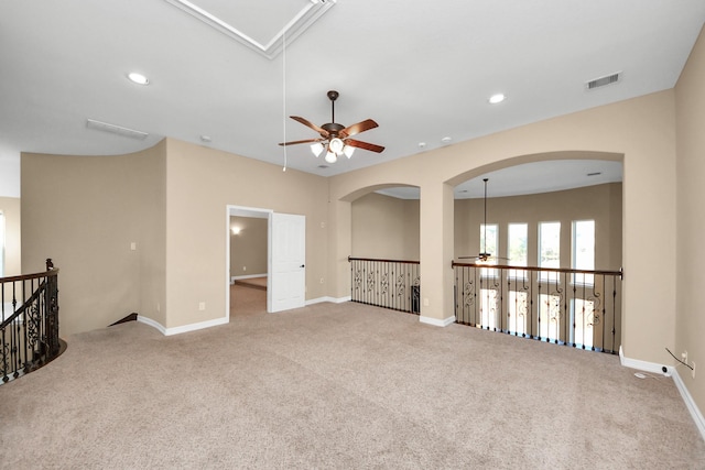 carpeted empty room with ceiling fan