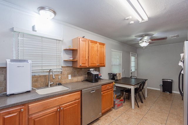 kitchen with sink, light tile patterned flooring, ceiling fan, tasteful backsplash, and stainless steel dishwasher