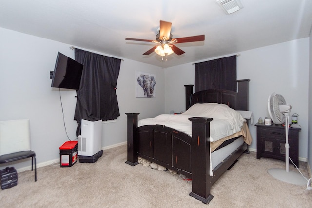 bedroom with ceiling fan and light carpet