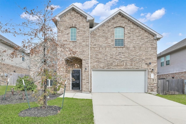 view of front of home featuring a front lawn and a garage