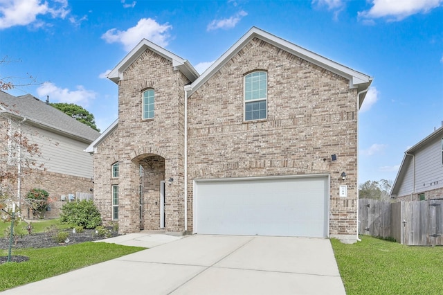 front facade featuring a front lawn and a garage