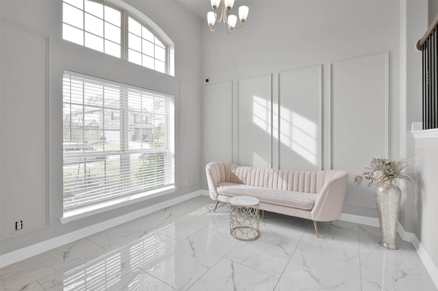 sitting room featuring a notable chandelier