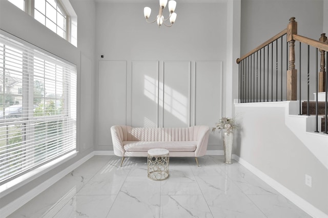 unfurnished room with a notable chandelier