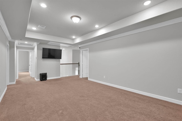 basement with crown molding and carpet floors