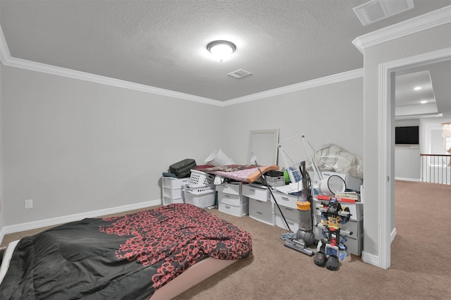 carpeted bedroom with a textured ceiling and crown molding