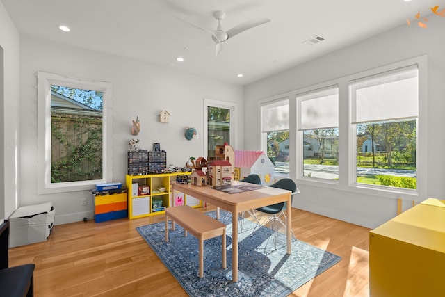 office space featuring light wood-type flooring and ceiling fan