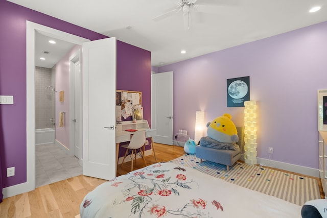 bedroom with ceiling fan, light hardwood / wood-style floors, and connected bathroom