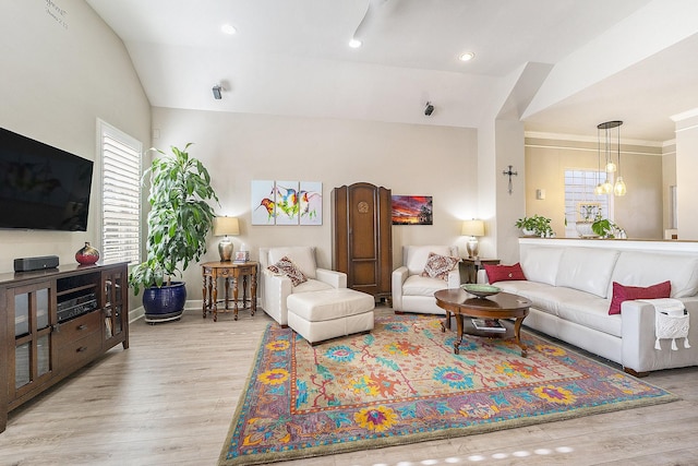 living room with vaulted ceiling and light hardwood / wood-style floors