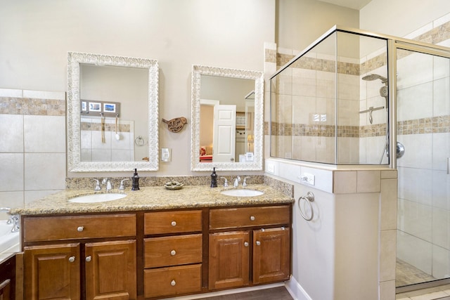 bathroom with an enclosed shower and vanity