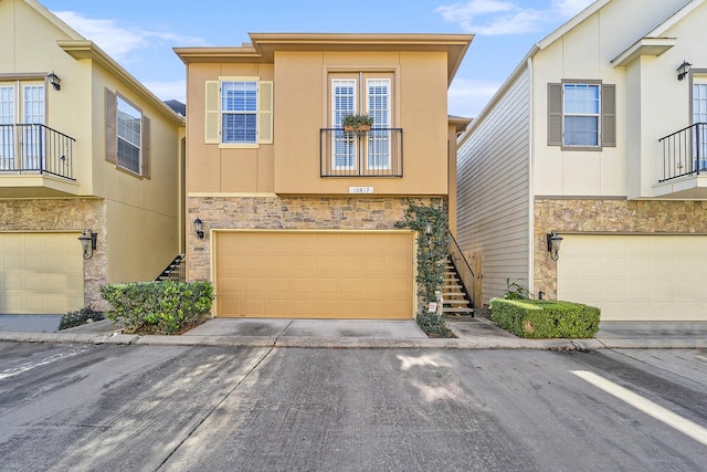 townhome / multi-family property featuring a garage