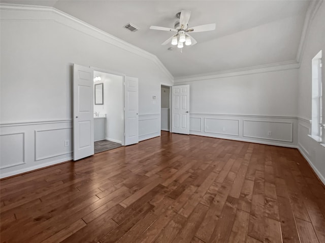 unfurnished bedroom featuring ceiling fan, vaulted ceiling, ornamental molding, and dark hardwood / wood-style floors