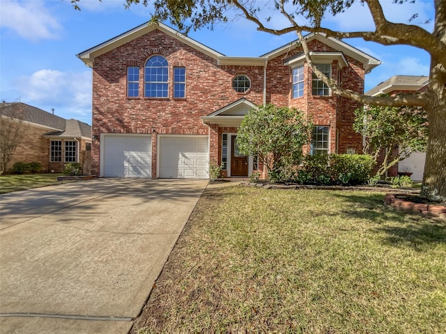 view of front property featuring a front lawn and a garage