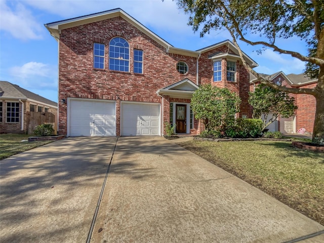 view of front facade with a front yard and a garage