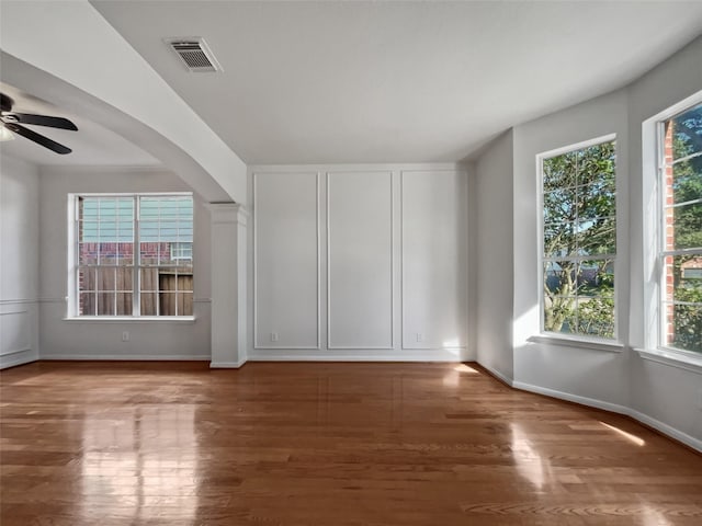 spare room with ceiling fan and hardwood / wood-style flooring