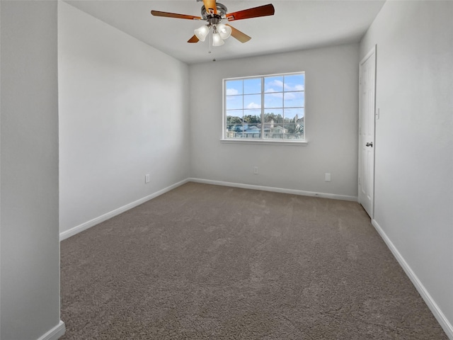 spare room featuring carpet flooring and ceiling fan