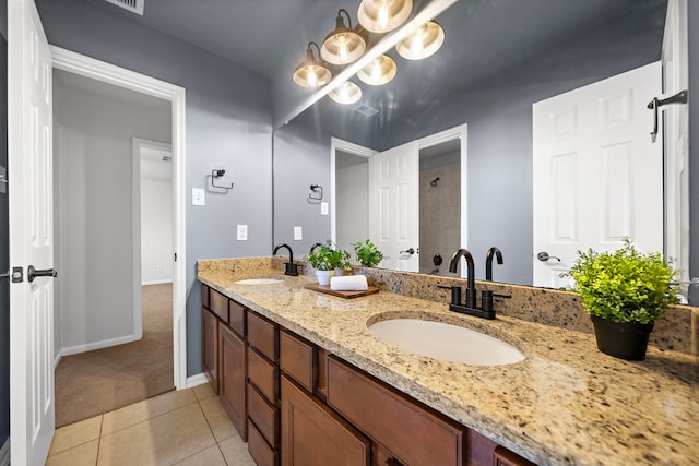 bathroom featuring vanity, tile patterned floors, and a notable chandelier