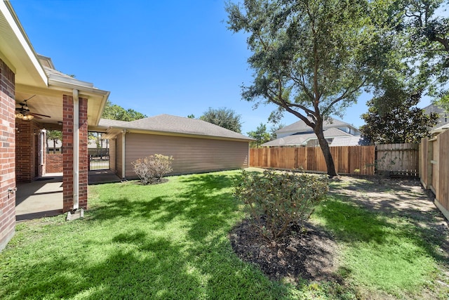 view of yard with ceiling fan