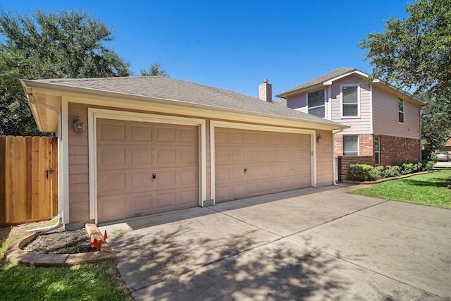 view of front of home featuring an outbuilding and a garage