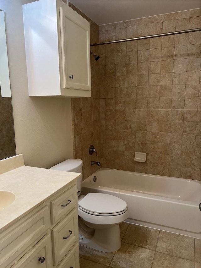 full bathroom with vanity, toilet, and tiled shower / bath