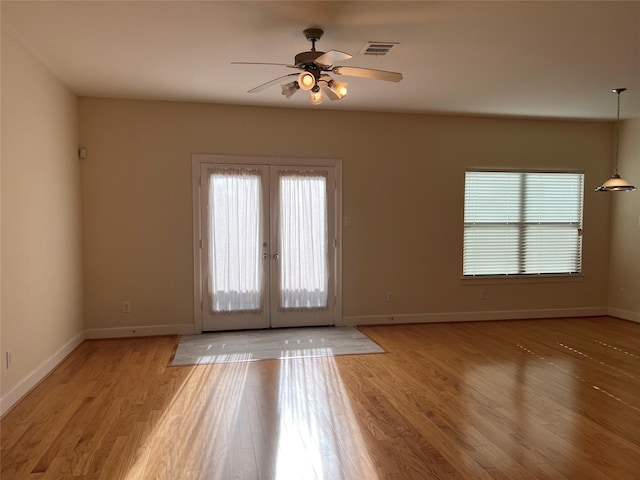 interior space with ceiling fan, light hardwood / wood-style floors, and french doors