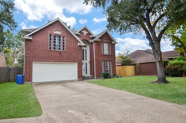 view of property featuring a front lawn and a garage