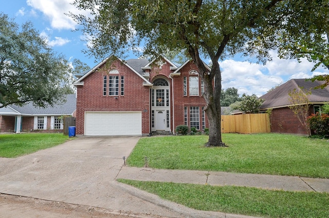 view of front property with a front lawn and a garage