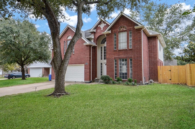 view of property featuring a front yard and a garage