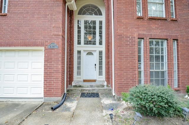 property entrance with a garage