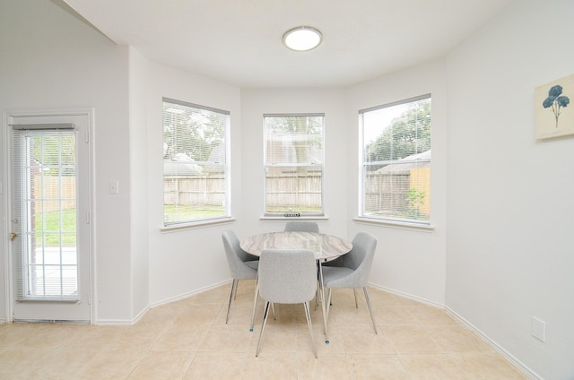 dining area with light tile patterned flooring