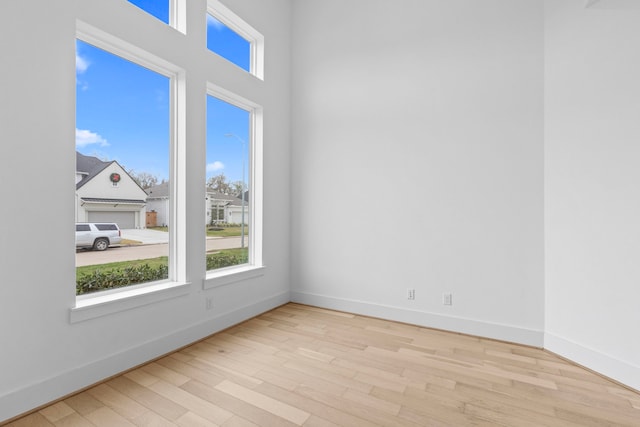 spare room featuring light hardwood / wood-style floors